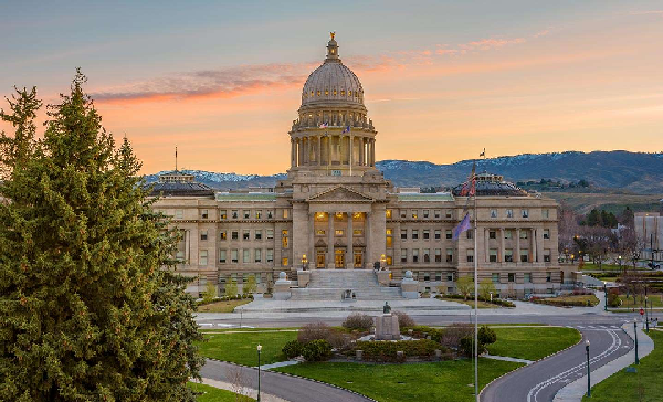 Sun setting behind Idaho state capitol building